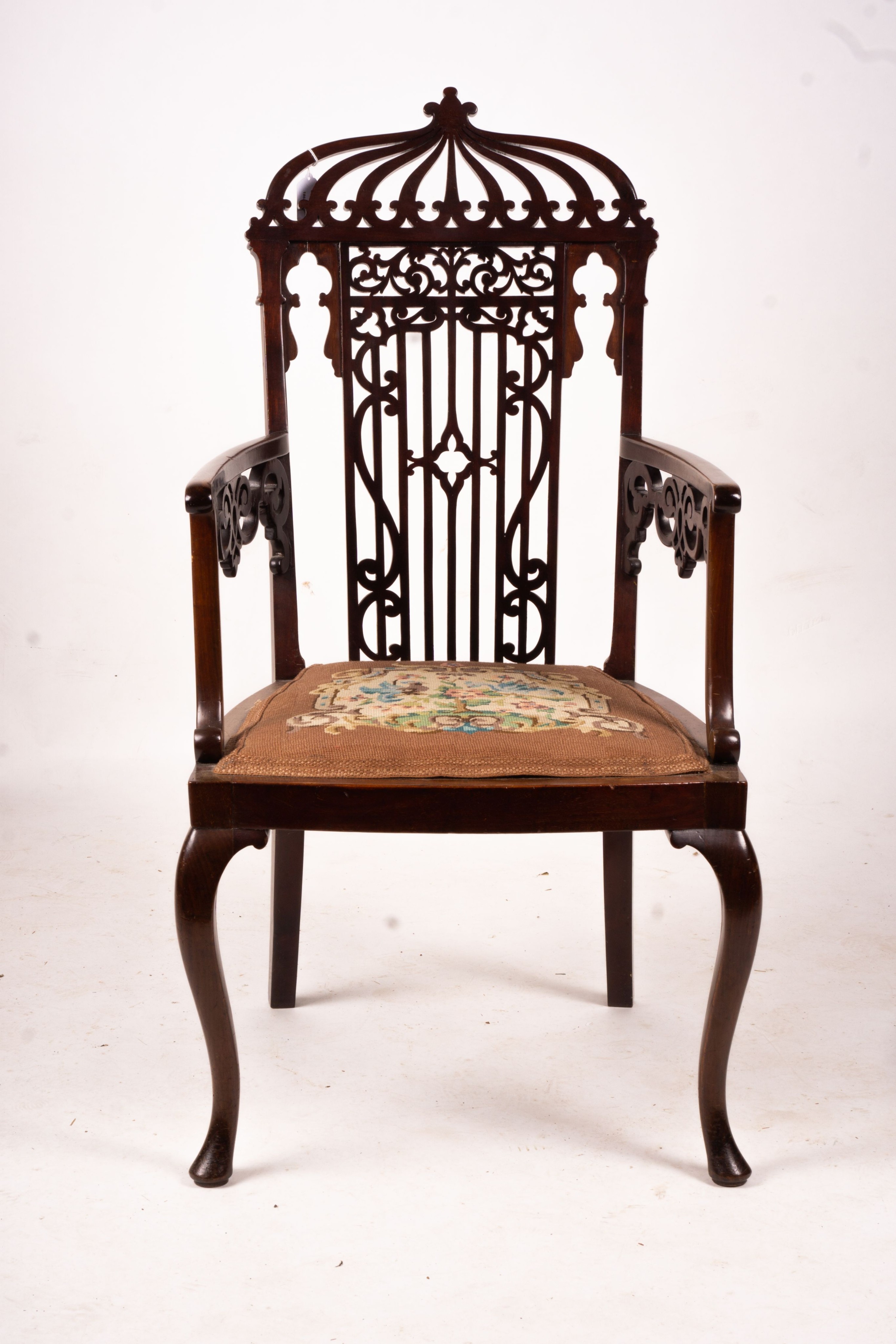 A late Victorian carved mahogany elbow chair